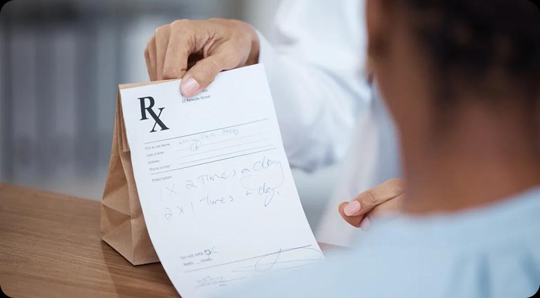 Doctor providing a prescription — addressing the root causes of prescription drug addiction in Newport Beach rehab programs.