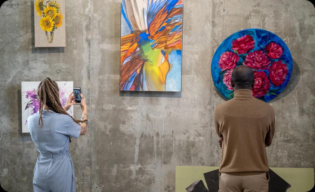 People enjoying therapeutic art in a Costa Mesa gallery — holistic healing and art therapy options available at local drug rehab centers.