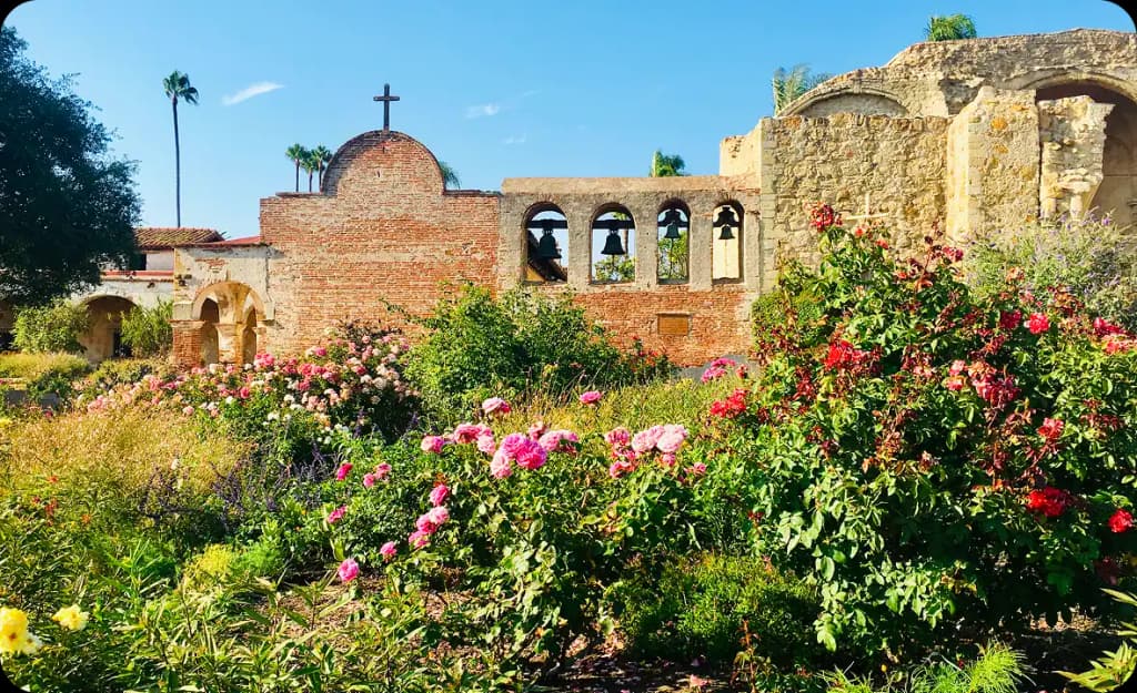Vibrant garden and historic mission architecture in San Juan Capistrano — blending culture, nature, and hope for a fresh start in recovery.