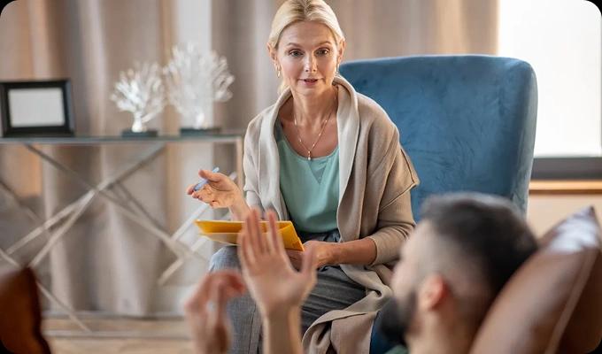 Therapist guiding a patient in an Intensive Outpatient Program (IOP) — flexible treatment options in Newport Beach.