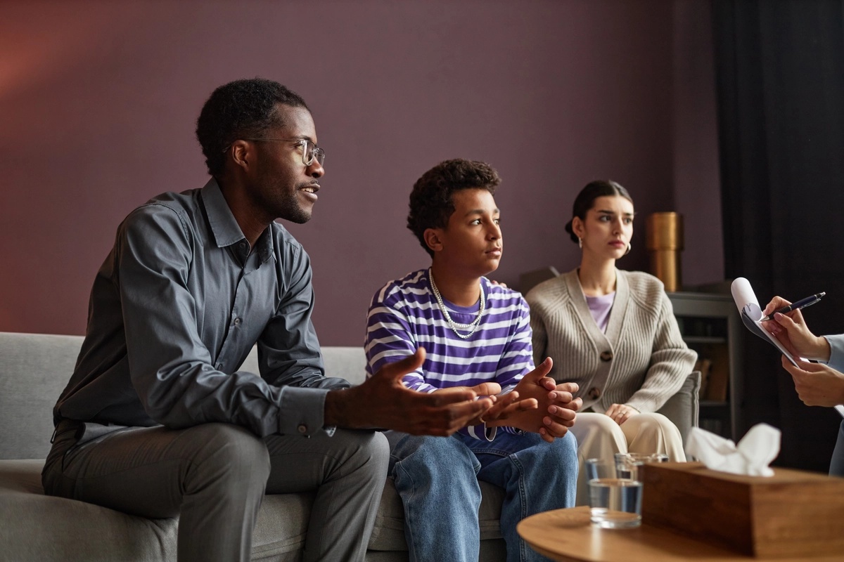 Family Counseling: Family speaking to a therapist