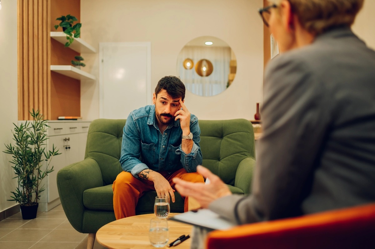 CBT: Depressed man speaking to his therapist