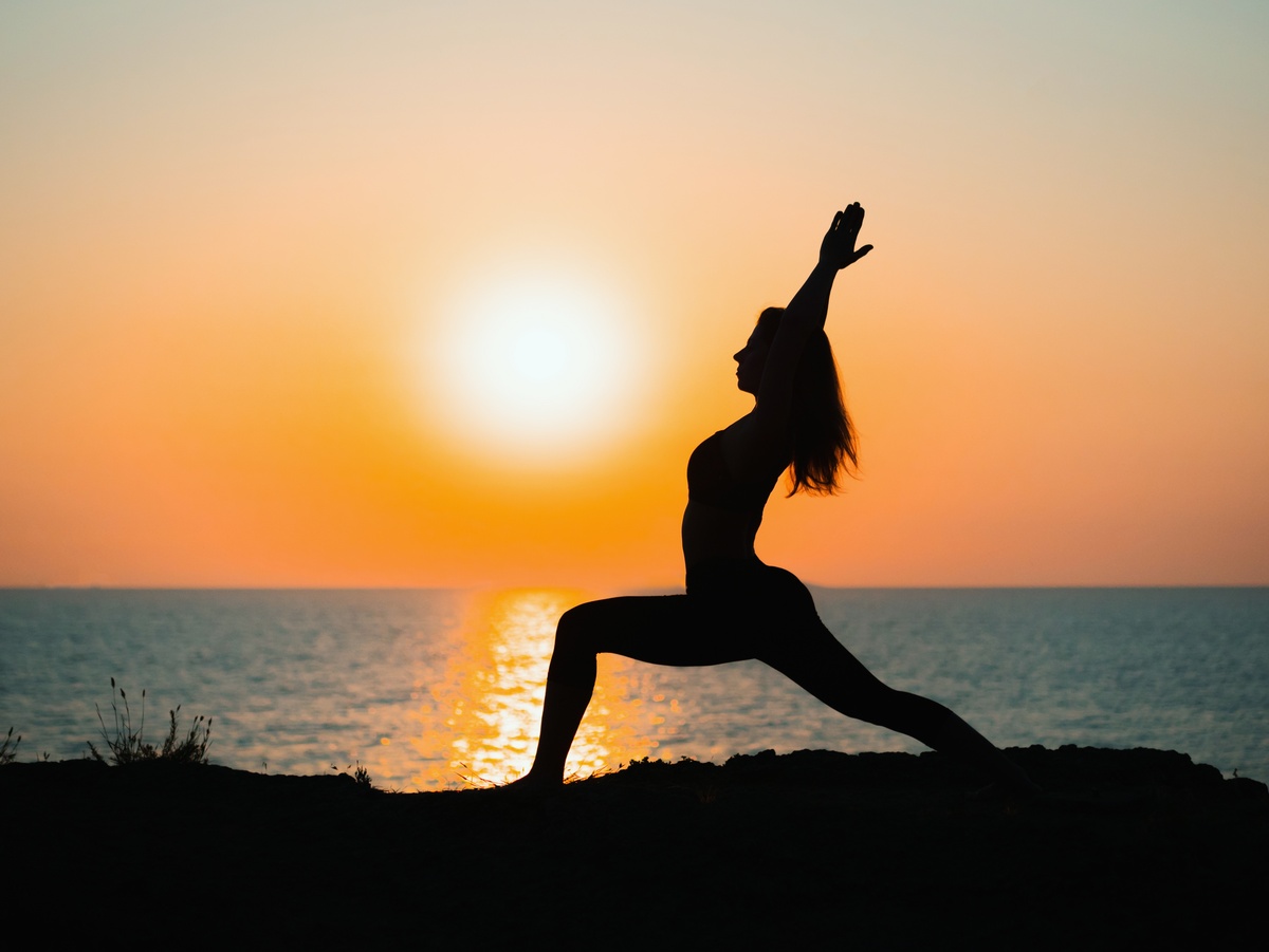 Yoga in the sunset to manage depression