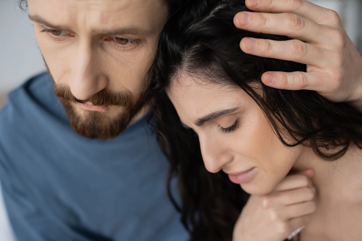 Woman Leaning on Man for Support with mental Illness
