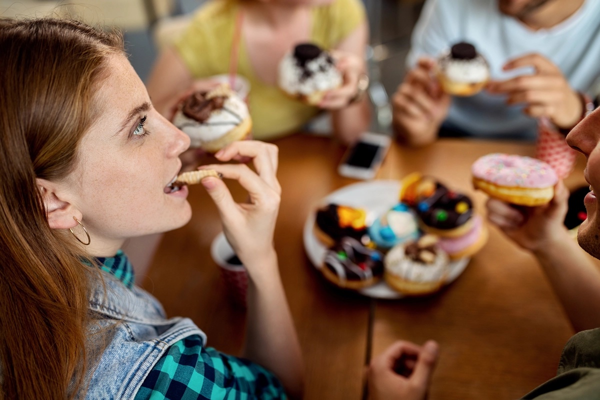 Food Addiction: Friends eating donuts
