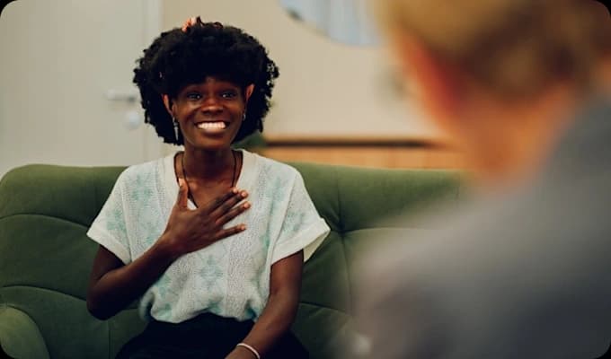 Happy woman engaging in individual counseling — personalized treatment plans at Costa Mesa rehab centers promote lasting recovery.